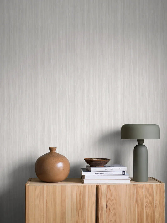 Fresh, bright and inviting, our Dag wallpaper is colored in a crisp palette of shimmering white and soft grey hues