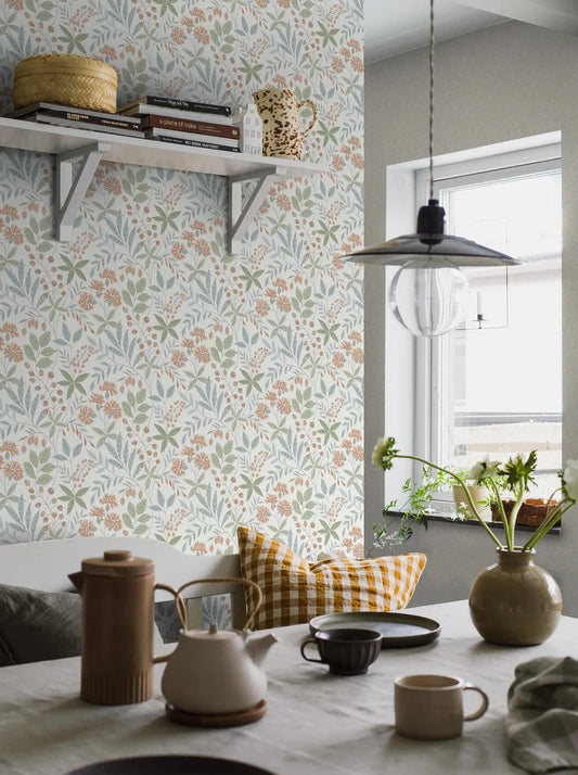 Dress your walls in playful vibes and lively charm with Vilma wallpaper in lovely blue, green and rusty red tones.