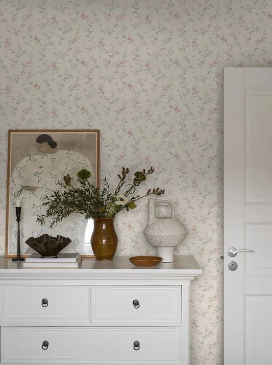 Dress your walls with a touch of shabby chic and romantic expression with Viktoria wallpaper in dreamy cream, soft brown and pretty blue and pink hues.