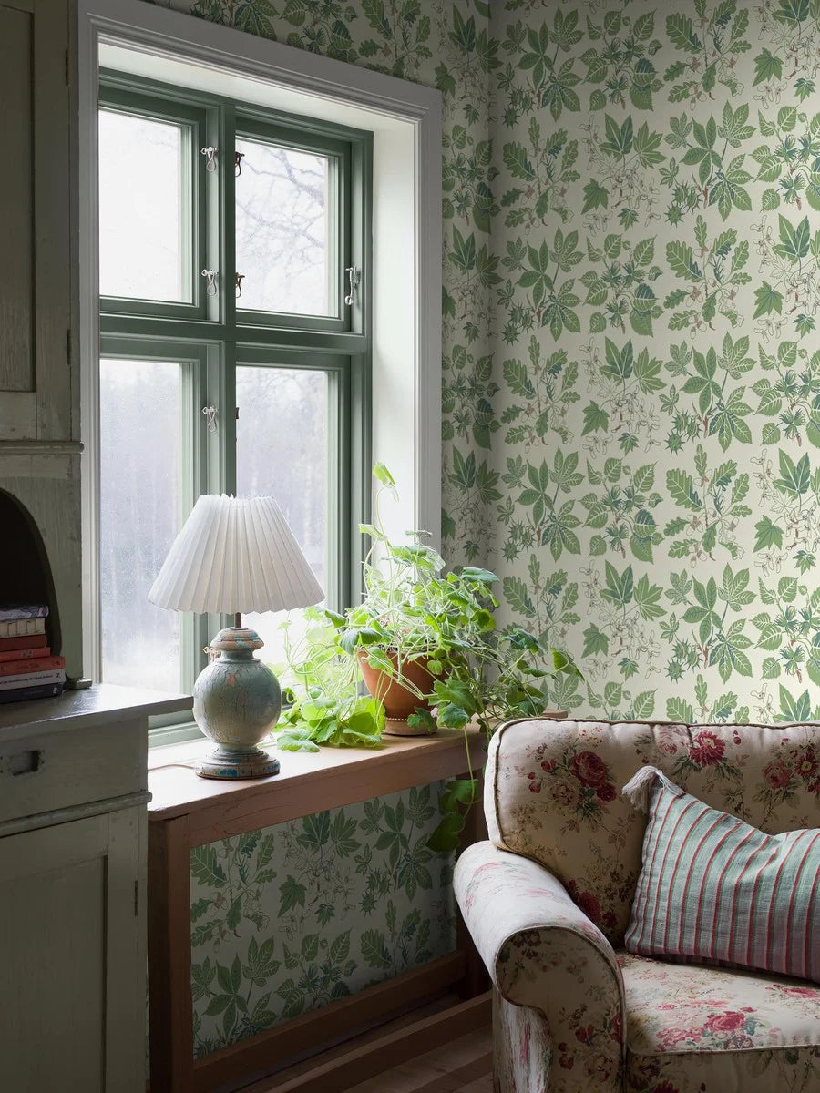 Set on a warm white background with fresh green and brown detailing, our Arboretum wallpaper in surface print is contemporary and playful.