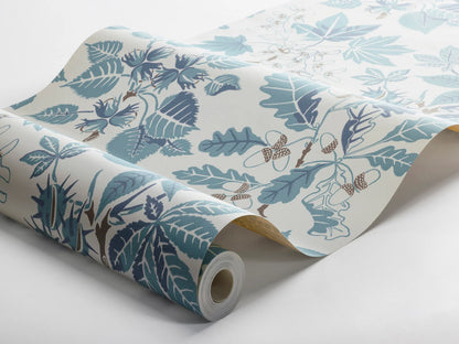 Colored in turquoise and warm blue tones accented with brown details on a warm white background, our Arboretum wallpaper transports you to a whimsical world.