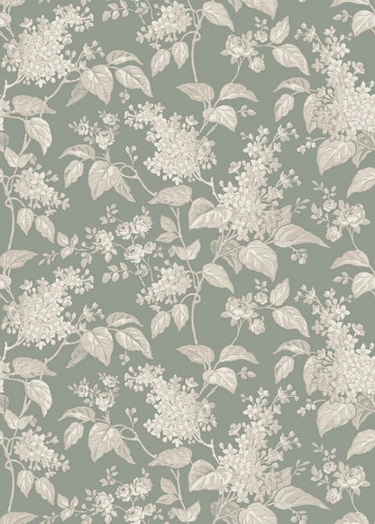 This Syren wallpaper in green features a delicate silhouette pattern of lilac branches and small roses, surface printed in beige and cream on a powdery jade background.