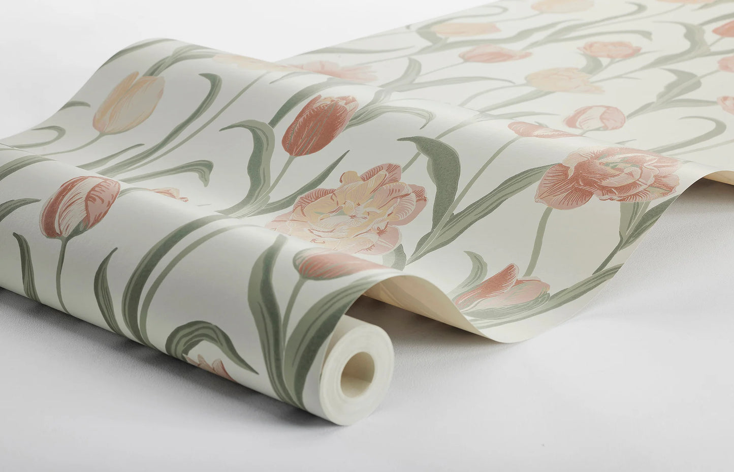 This joyful La Belle Epoque wallpaper is adorned with a variety of tulips in different colors, from pink and apricot tones with buttery yellow edges, to cream-yellow flowers.