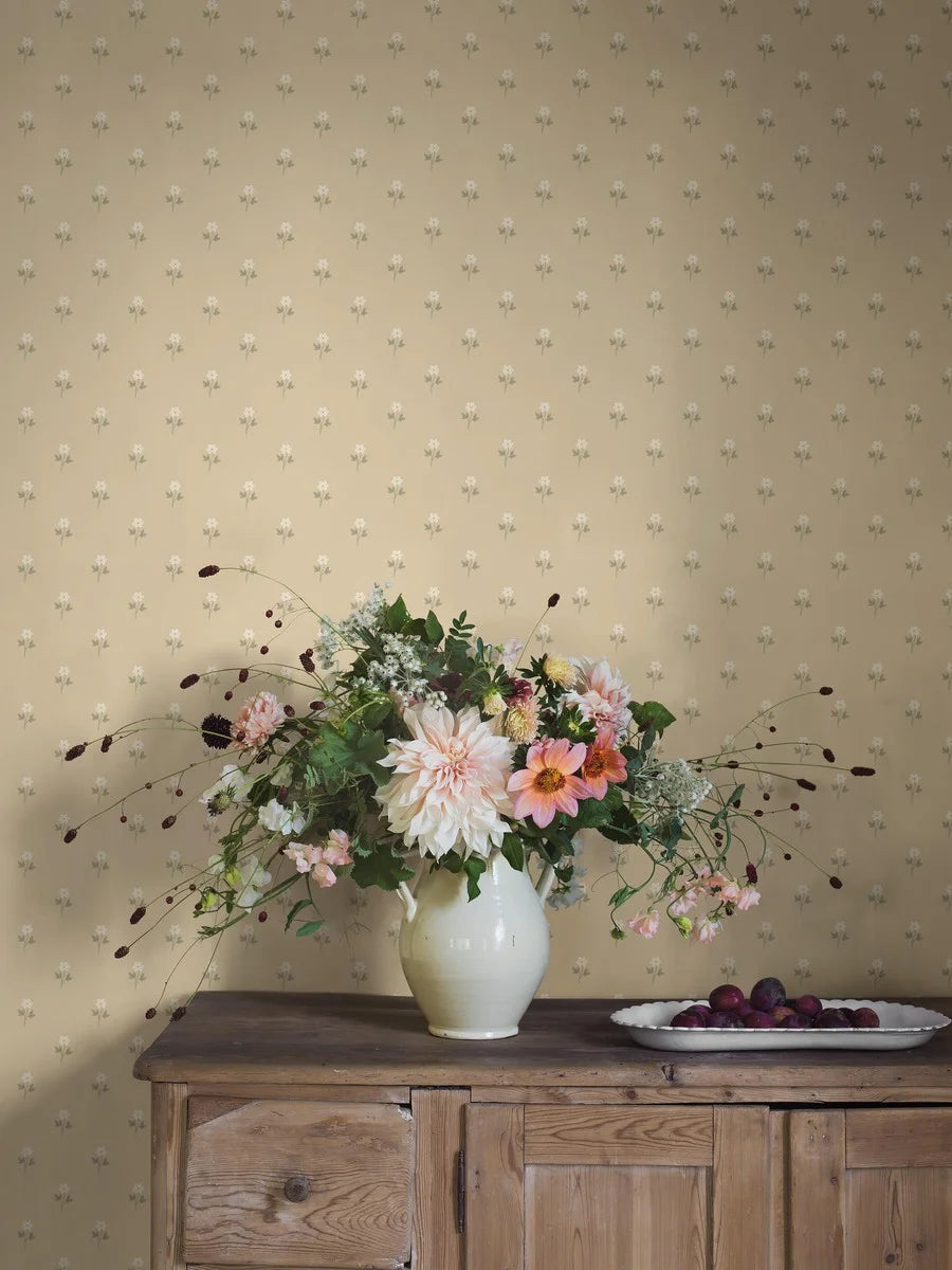 This lovely Anemone wallpaper has white flowers with warm white centers and green foliage on a soft sorbet yellow background.