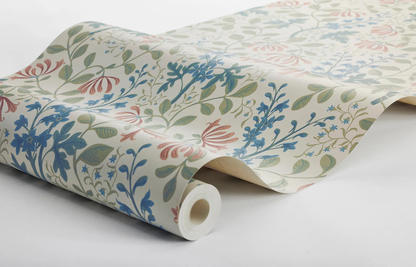 Trädgårdsfröjd wallpaper has a rich and multicolored floral pattern on a beige background.