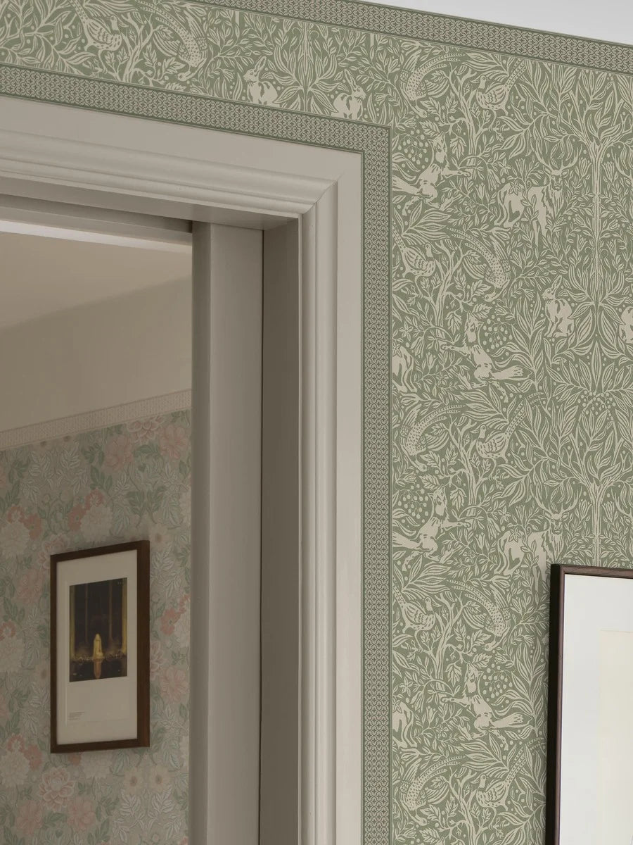 Enhance your home with our Kalles Bård wallpaper border in muted green and beige hues.