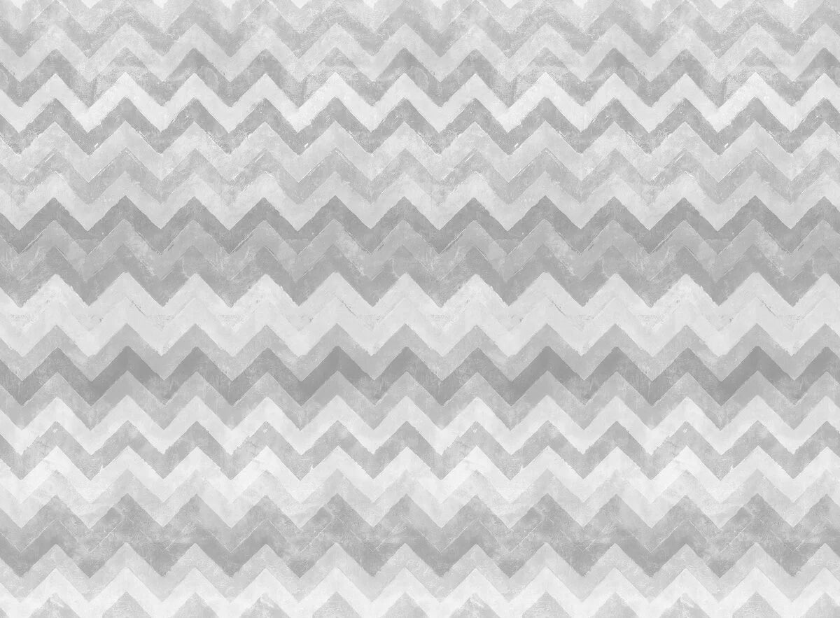 Within its zigzags, chevrons and cool grey color palette, this wallpaper harmonizes Nordic and African influences