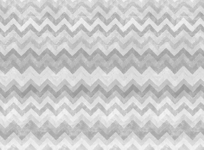 Within its zigzags, chevrons and cool grey color palette, this wallpaper harmonizes Nordic and African influences