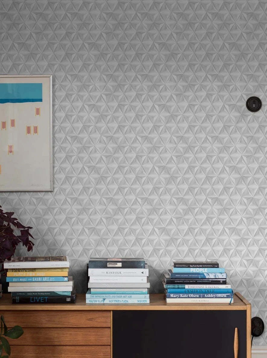 Origami is a light, graphic wallpaper that plays with geometry, shadows, and perspective. Inspired by the Japanese art form of origami, this wallpaper inspires creativity with its simple yet fascinating pattern.