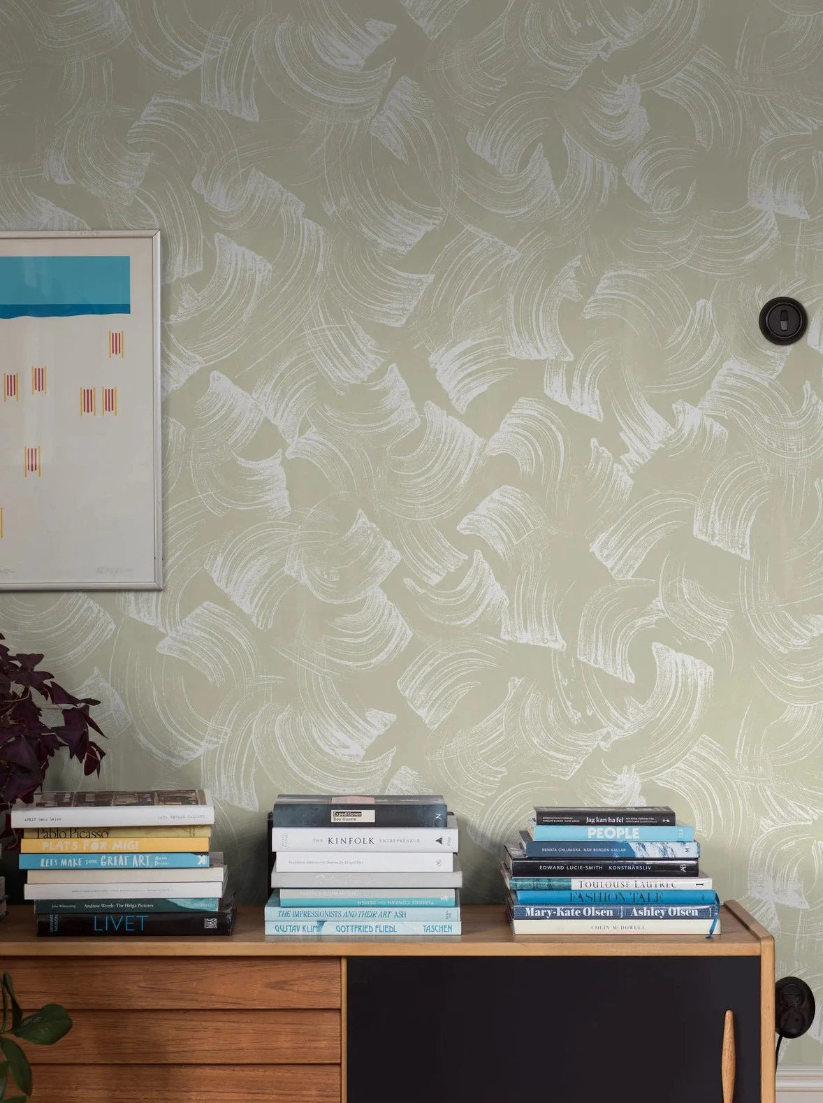 The Swirl Mural wallpaper comes in a muted beige hue with warm undertones