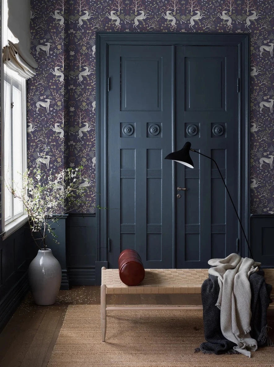 The dark wallpaper Whippet has a dense, richly decorated pattern of playful whippet dogs and delicate vegetation; foliage, flowers, fruits, berries, and swaying grass. 