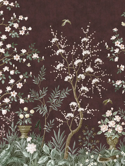 The wine-red wallpaper Magnolia Garden is adorned with a delicate, hand-painted pattern of a lush garden with Asian characteristics – a classic chinoiserie wallpaper custom printed to fit your wall.