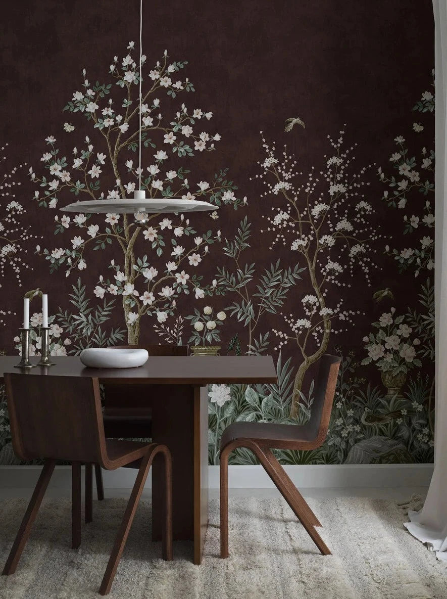 The wine-red wallpaper Magnolia Garden is adorned with a delicate, hand-painted pattern of a lush garden with Asian characteristics – a classic chinoiserie wallpaper custom printed to fit your wall.