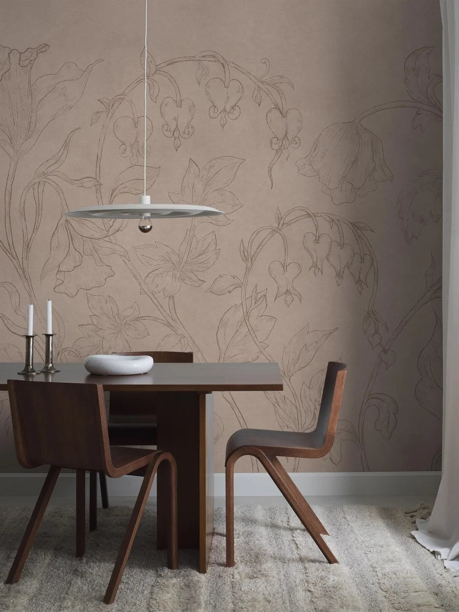 The mural wallpaper Burning Heart is like a blooming wall painting, sketched in pencil on a muted pink plastered wall with beautiful patina. 