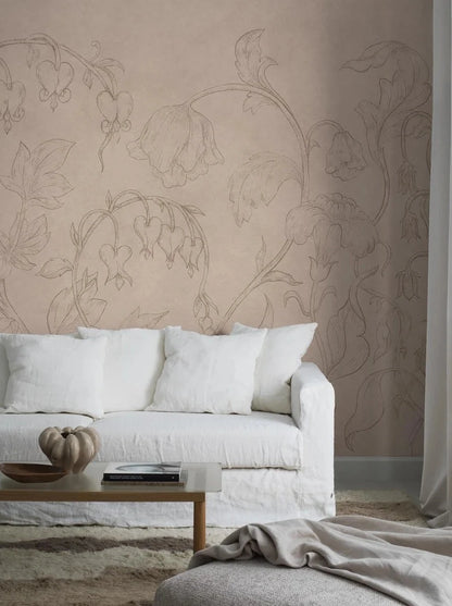 The mural wallpaper Burning Heart is like a blooming wall painting, sketched in pencil on a muted pink plastered wall with beautiful patina. 