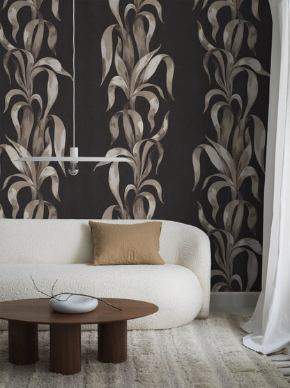 This version of the Agave wallpaper comes in a subdued color palette with leaves in various tones of beige, brown, and white, contrasting against the black, subtly textured background.