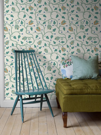 Designed by Arthur Berger in the early 20th century, this Mekka wallpaper is presented here in a new green palette with blue and yellow accents.