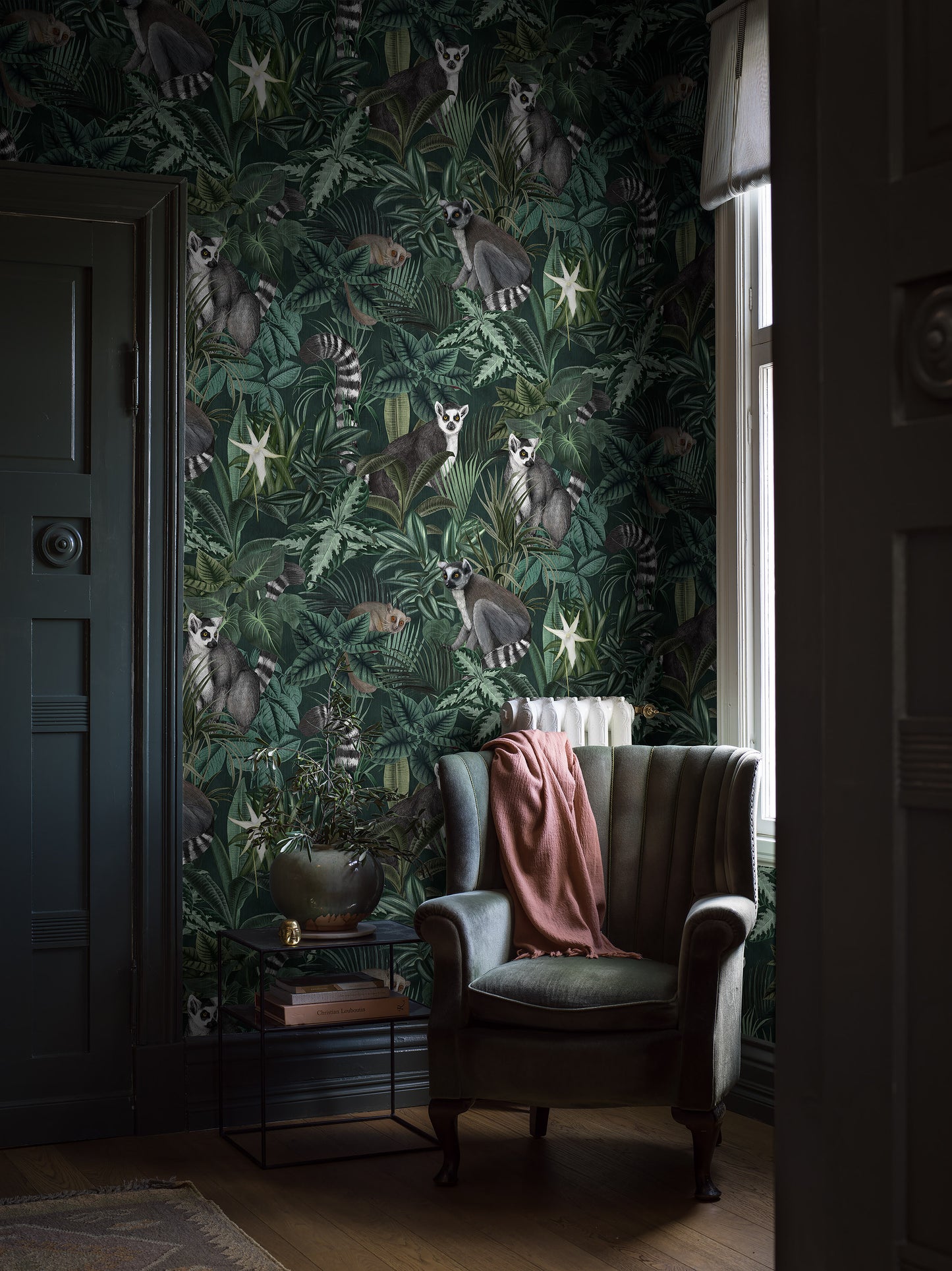 Colored in a luscious dark green color scheme, our Madagascar wallpaper adds a soothing feel to rooms.