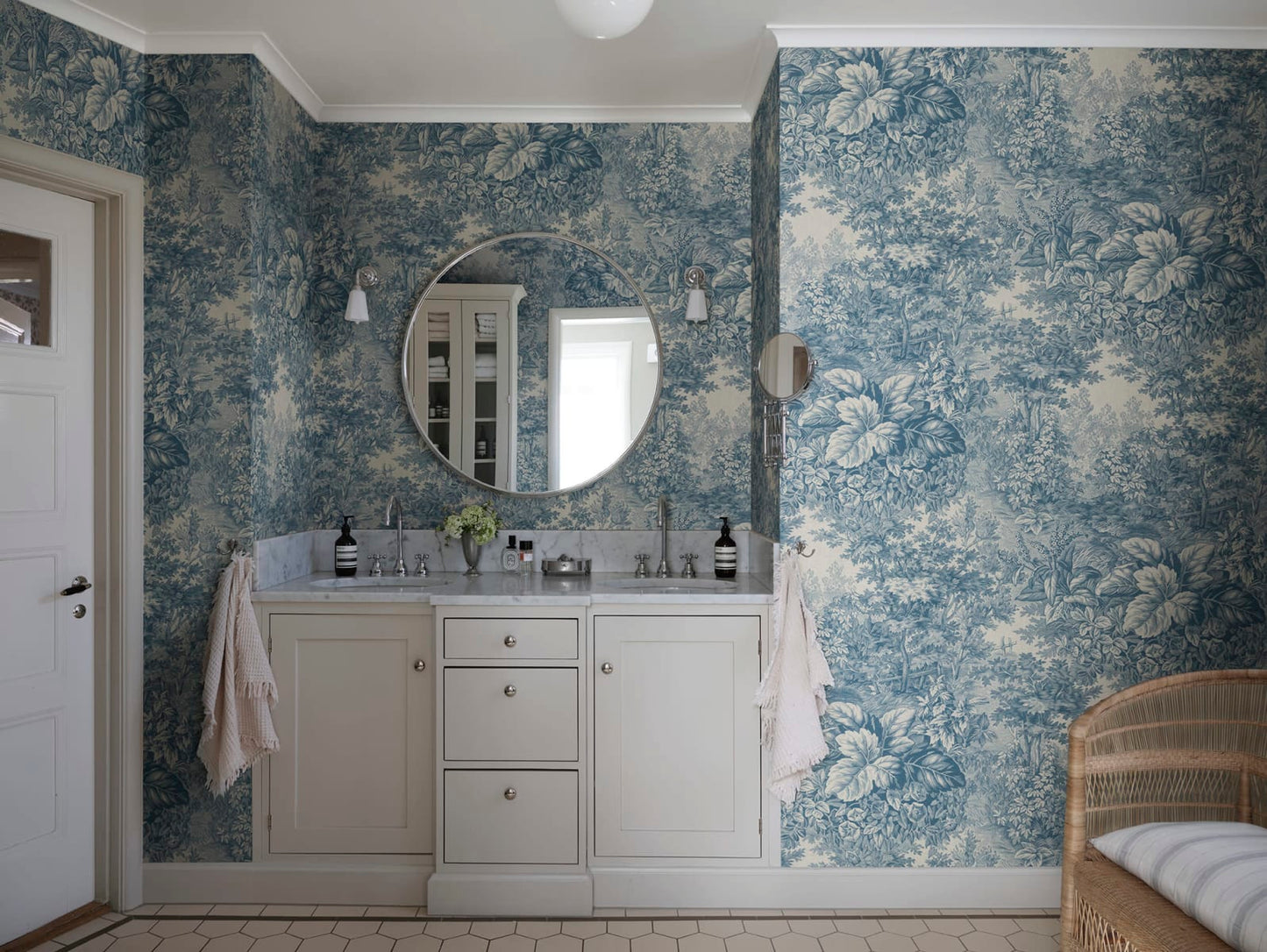 Based on a textile print from 19th century France featuring lush forest clearings that lay the wallpaper like an embracing blanket over the walls.